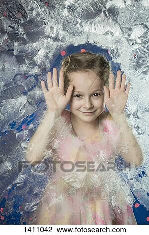 Portrait of cute girl leaning on frozen glass View Large Photo Image Stock Image - Portrait of cute girl leaning on frozen glass. Fotosearch