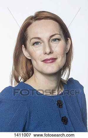 Portrait of smiling mature woman against white background View Large Photo Image Stock Photo - Portrait of smiling mature woman against white background. Fotosearch