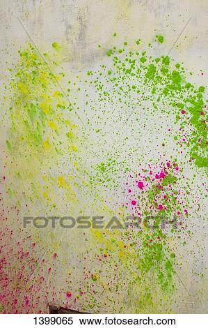Stock Photography - Powder paint on wall during Holi festival. Fotosearch
