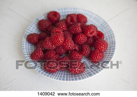 Raspberries in plate on white background View Large Photo Image Stock Image - Raspberries in plate on white background. Fotosearch