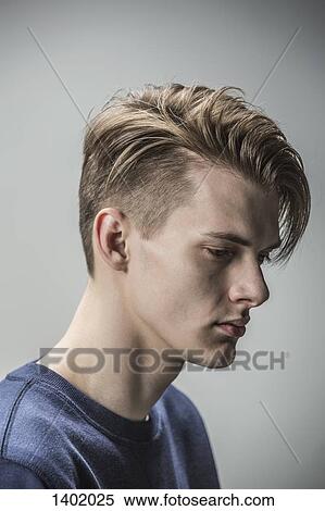 Sad young man against gray background View Large Photo Image Stock Photography - Sad young man against gray background. Fotosearch