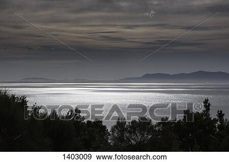Stock Photo - Scenic view of sea at dusk. Fotosearch