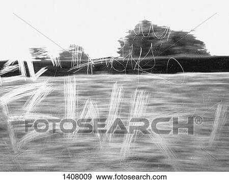 Scribbling on glass window of moving vehicle View Large Photo Image Stock Photo - Scribbling on glass window of moving vehicle. Fotosearch