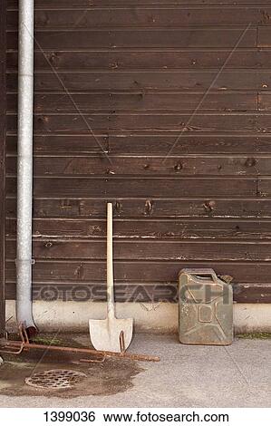 Shovel and container against wooden wall View Large Photo Image Stock Photograph - Shovel and container against wooden wall. Fotosearch
