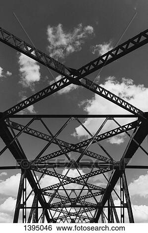 Silhouette bridge against cloudy sky View Large Photo Image Stock Photograph - Silhouette bridge against cloudy sky. Fotosearch