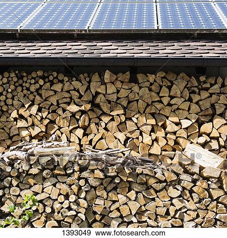 Solar panels on stack of logs View Large Photo Image Stock Photo - Solar panels on stack of logs. Fotosearch
