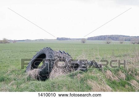 Tires on grassy field against clear sky View Large Photo Image Stock Image - Tires on grassy field against clear sky. Fotosearch