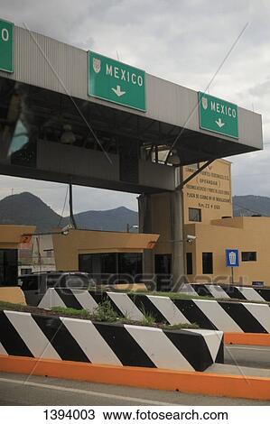 Stock Image - Toll booth on highway against sky. Fotosearch