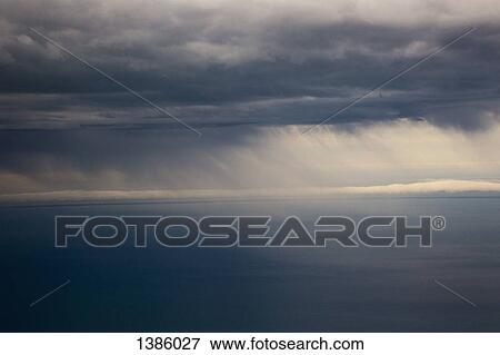 Tranquil view of sea against cloudy sky View Large Photo Image Stock Photo - Tranquil view of sea against cloudy sky. Fotosearch