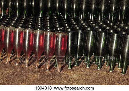 Upside down champagne bottles in cave View Large Photo Image Stock Photo - Upside down champagne bottles in cave. Fotosearch