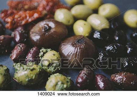 Various olives with onions on table View Large Photo Image Picture - Various olives with onions on table. Fotosearch