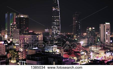Picture - "View of illuminated cityscape at night, Ho Chi Minh City, Vietnam". Fotosearch