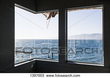 Stock Image - View of sea through boat window. Fotosearch