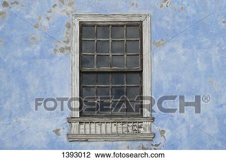 Stock Image - Window on weathered building. Fotosearch