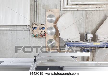 A sliding table saw and other equipment in workshop View Large Photo Image Stock Photo - A sliding table saw and other equipment in workshop. Fotosearch