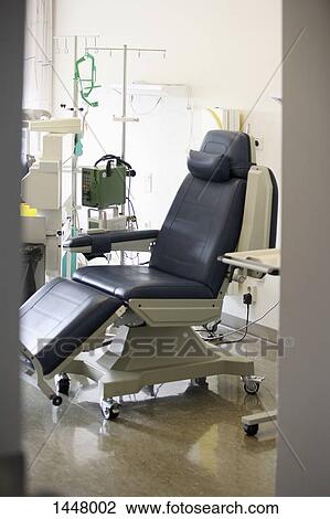 A surgical procedure chair in a hospital View Large Photo Image Stock Image - A surgical procedure chair in a hospital. Fotosearch