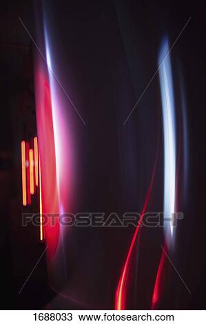 Abstract image of red and gray light trails over black background View Large Photo Image Stock Image - Abstract image of red and gray light trails over black background. Fotosearch