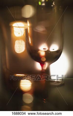 Abstract image of wineglass against illuminated background View Large Photo Image Picture - Abstract image of wineglass against illuminated background. Fotosearch