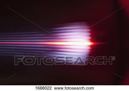 Stock Image - Abstract light trails against black background. Fotosearch