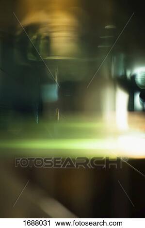 Stock Image - Abstract light trails against black background. Fotosearch