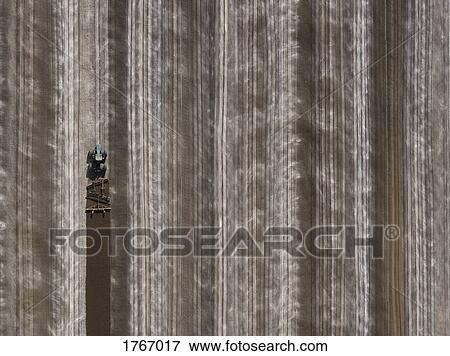 Aerial view agricultural tractor plowing field, Bakersfield, California, USA View Large Photo Image Stock Photo - Aerial view agricultural tractor plowing field, Bakersfield, California, USA. Fotosearch