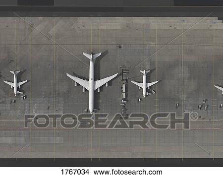 Picture - Aerial view airplanes parked on tarmac at airport. Fotosearch