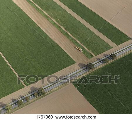 Aerial view combine harvester in agricultural crop, Hohenheim, Baden-Wuerttemberg, Germany View Large Photo Image Stock Image - Aerial view combine harvester in agricultural crop, Hohenheim, Baden-Wuerttemberg, Germany. Fotosearch