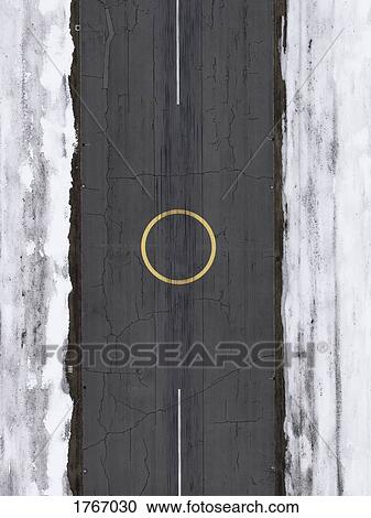 Stock Image - Aerial view helicopter landing circle on airport tarmac surrounded by snow. Fotosearch