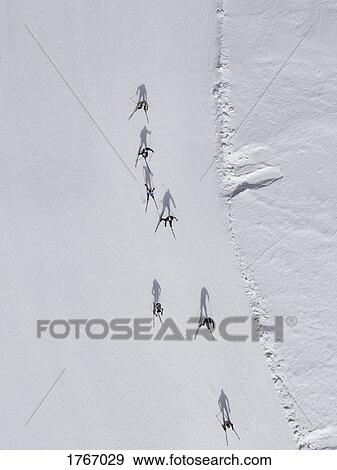 Aerial view of skiers on snowy slope, St. Moritz, Switzerland View Large Photo Image Stock Photo - Aerial view of skiers on snowy slope, St. Moritz, Switzerland. Fotosearch