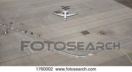 Aerial view private airplane parked on tarmac at airport View Large Photo Image Stock Image - Aerial view private airplane parked on tarmac at airport. Fotosearch