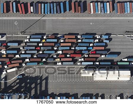Aerial view semi trucks with containers in sunny shunting yard, Los Angeles, California, USA View Large Photo Image Stock Image - Aerial view semi trucks with containers in sunny shunting yard, Los Angeles, California, USA. Fotosearch