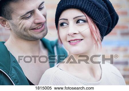 Stock Photography - Affectionate young adult couple. Fotosearch