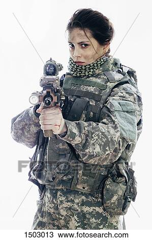 Angry army soldier aiming rifle while standing against white background View Large Photo Image Stock Image - Angry army soldier aiming rifle while standing against white background. Fotosearch