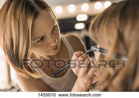 Artist applying make-up on fashion model View Large Photo Image Stock Image - Artist applying make-up on fashion model. Fotosearch
