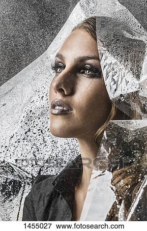 Stock Photo - Beautiful woman wrapped in plastic. Fotosearch
