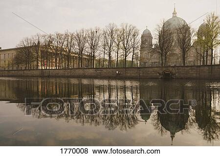 Berlin Cathedral along tranquil Spree River, Berlin, Germany View Large Photo Image Stock Photo - Berlin Cathedral along tranquil Spree River, Berlin, Germany. Fotosearch