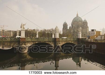 Stock Image - Berlin Cathedral behind Schlossbrucke Bridge and Spree River, Berlin, Germany. Fotosearch