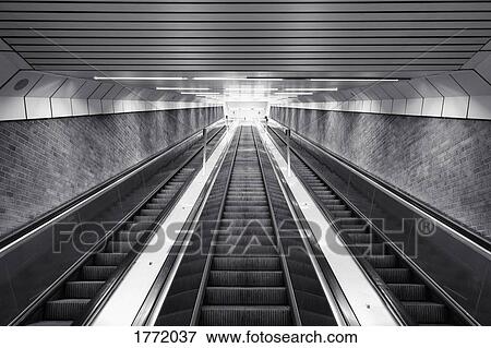 Black and white of ascending escalator View Large Photo Image Stock Photo - Black and white of ascending escalator. Fotosearch