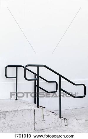 Black railing on steps by white wall View Large Photo Image Stock Image - Black railing on steps by white wall. Fotosearch
