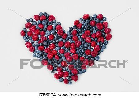 Blueberries and raspberries arranged in heart shape View Large Photo Image Picture - Blueberries and raspberries arranged in heart shape. Fotosearch