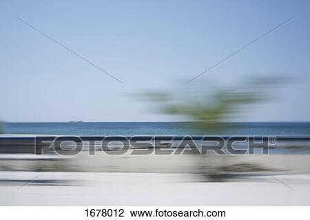 Blurred motion view of beach against clear sky View Large Photo Image Stock Image - Blurred motion view of beach against clear sky. Fotosearch