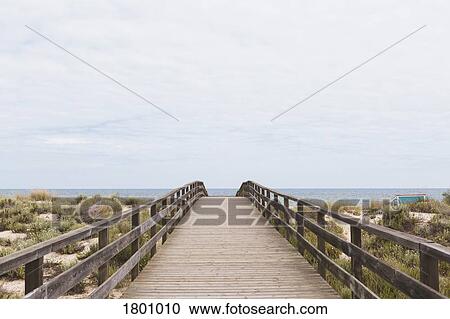 Boardwalk leading to ocean beach, Manta Rota, Algarve, Portugal View Large Photo Image Stock Image - Boardwalk leading to ocean beach, Manta Rota, Algarve, Portugal. Fotosearch