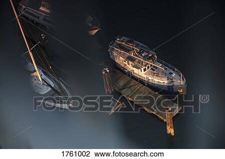 Boats moored at tranquil dock View Large Photo Image Stock Image - Boats moored at tranquil dock. Fotosearch