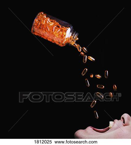 Bottle of orange medicine capsules emptying into mans mouth View Large Photo Image Stock Photography - Bottle of orange medicine capsules emptying into mans mouth. Fotosearch