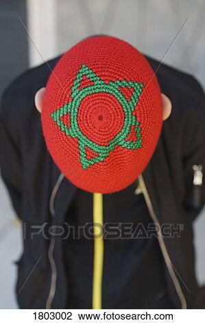 Boy with Moroccan star flag hat bowing, Marrakesh, Morocco View Large Photo Image Stock Image - Boy with Moroccan star flag hat bowing, Marrakesh, Morocco. Fotosearch
