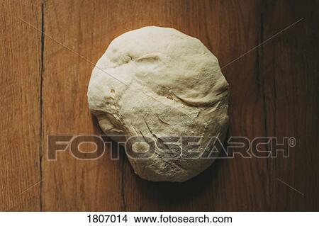 Bread dough on rustic wooden surface View Large Photo Image Picture - Bread dough on rustic wooden surface. Fotosearch