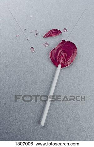 Broken heart-shape lollipop View Large Photo Image Stock Photograph - Broken heart-shape lollipop. Fotosearch