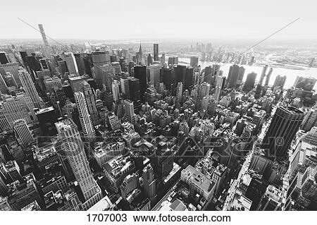 Buildings in Manhattan against sky seen from Empire State Building, New York City, New York, USA View Large Photo Image Stock Image - Buildings in Manhattan against sky seen from Empire State Building, New York City, New York, USA. Fotosearch