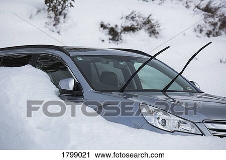 Car parked in snow with windshield wipers up View Large Photo Image Stock Image - Car parked in snow with windshield wipers up. Fotosearch