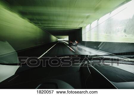 Car point of view driving in tunnel View Large Photo Image Stock Photo - Car point of view driving in tunnel. Fotosearch